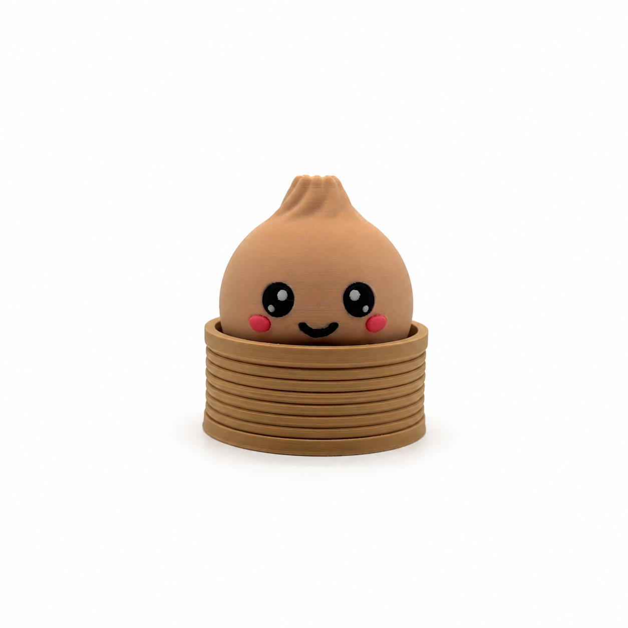 Dumplin clicker, a 3D printed dumpling fidget clicker sitting in a steam basket